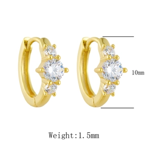Detail view of 10mm gold hoop earrings featuring three sparkling zircon stones
