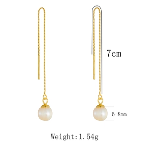 Detail of 7cm long golden silver chain earrings with 6-8mm natural white pearls