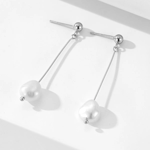 Elegant 925 sterling silver tassel earrings with natural baroque pearls in a minimalist design