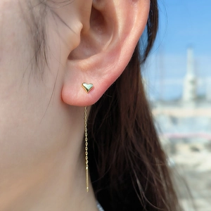 S925 sterling silver 14K gold plated heart chain earrings worn in natural outdoor light