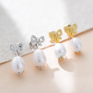 Boucles d'oreilles nœud en argent 925 avec zirconiums et perles d'eau douce