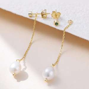 S925 sterling silver drop earrings featuring green gems and elegant pearl tassels