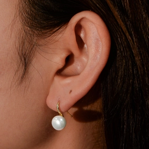 Elegant S925 silver pearl drop earrings with high heel design and sparkling zircon accents