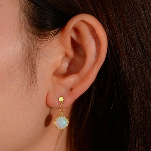 Elegant gold plated drop earrings featuring iridescent round opal stones on long chains