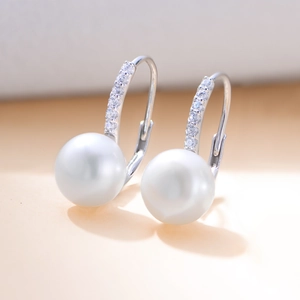 Elegant s925 silver earrings with white freshwater pearls and shimmering zircon accents