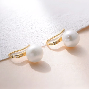 Detailed macro view of S925 silver high heel earrings with freshwater pearls and zircon