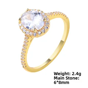 Detail of 2.4g gold ring with 6x8mm oval zircon in halo setting and side stones