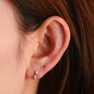 Detail of S925 silver moonstone stud earring with gold plating and clear zircon stone