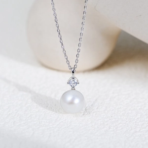 Elegant S925 silver necklace featuring a round white pearl and sparkling zircon pendant