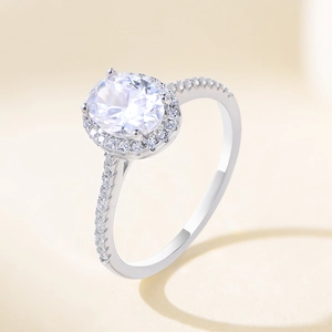 Elegant S925 silver engagement ring with oval cut zircon and halo pavé diamond accents
