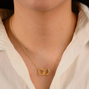 S925 sterling silver gold twisted double ring necklace worn on neck with white shirt