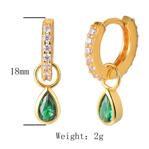 Detail view of gold S925 sterling silver hoop earrings with emerald green pear-cut zircon