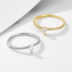 Gold and silver minimalist sterling silver rings with teardrop zircon and pavé setting