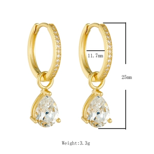 Detail of S925 silver gold-plated teardrop earrings with pavé cubic zirconia settings