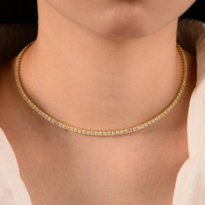 S925 silver gold plated tennis necklace with 2.5mm cubic zirconia on white shirt