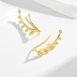Minimalist gold leaf ear crawlers with sparkling white zircons for a nature-inspired look
