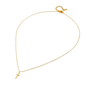 Minimalist gold cross pendant necklace with polished surface and delicate chain link