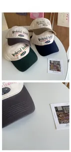Close-up of color-block baseball caps with Weekend Holiday embroidery and fine stitching