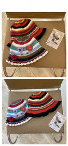 Detail of handmade crochet bucket hat with colorful stripes and floral embroidery accents