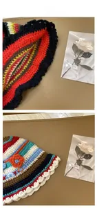 Detail of handmade crochet striped bucket hats with 3D flower and wavy edges