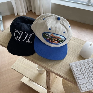 Retro hip-hop flat brim baseball caps with embroidery on a desktop lifestyle background