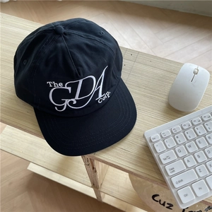 Classic black street style flat-brimmed cap with white 'The GDA Corp' embroidery detail