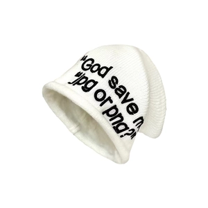 Trendy white ribbed knit beanie with black 'God save me jpg or png?' text embroidery