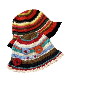 Handmade crochet striped bucket hat for women with colorful floral embroidery and XOXO text