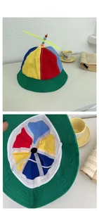Detail view of colorful propeller hat with internal lining and white elastic wind rope