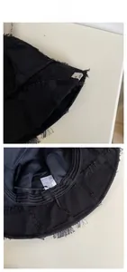 Detailed view of black cotton bucket hat featuring quilted stitching and adjustable inner drawstrings