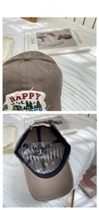 Detail of vintage brown baseball cap with camper embroidery and adjustable back strap