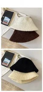 Texture detail of plush lamb wool bucket hats in creamy white, coffee, black, and beige
