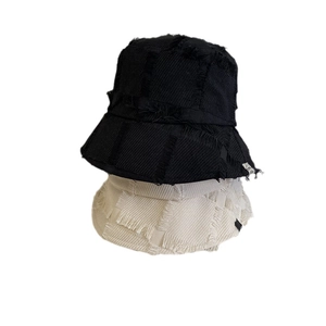 Vintage frayed edge bucket hats in black and beige twill cotton with distressed fringe