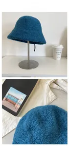 Close-up of deep blue lamb wool bucket hat showing thick fuzzy texture and knit details