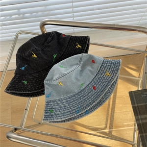 Denim bucket hats with colorful dinosaur embroidery in black and light blue wash finish