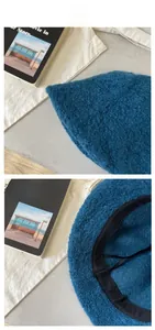 Detail of teal faux fur bucket hat showing inner adjustable drawstring and soft texture