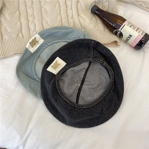Two-piece denim beret set in light blue and dark grey with vintage patch details