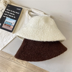 Minimalist lamb wool bucket hats in beige and brown for winter fashion accessories