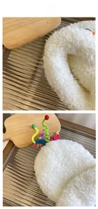 Close-up of white plush hat texture with colorful spiral ornaments on wood tray
