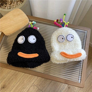Cute plush cartoon winter hats with big eyes and duck bills in black and white colors