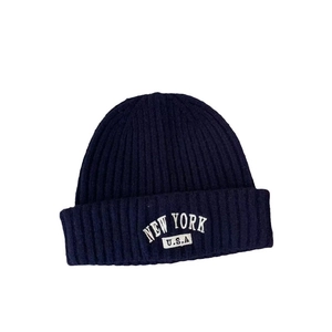 Vintage navy blue knit beanie with New York U.S.A. white embroidery on the cuff
