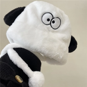 Cute puppy plush earflap hat with black and white faux fur and pom-poms for winter warmth