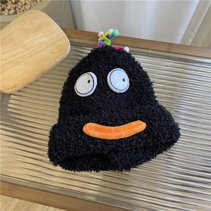 Cute black plush beanie with cartoon eyes and pom-poms for winter warmth