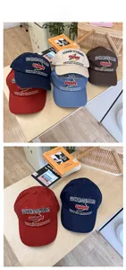 Detail of colorful cotton baseball caps with elegant embroidery and curved brims