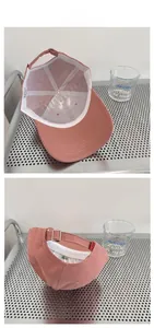 Detailed view of the pink cotton baseball cap showing adjustable metal buckle and inner sweatband