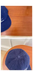 Close-up of high-quality embroidery and stitching on a navy cotton baseball cap