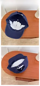Detail view of navy blue baseball cap interior and adjustable silver metal buckle