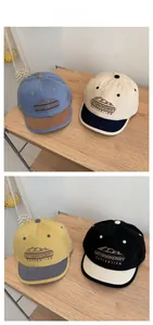 Detailed embroidery featuring mountain graphics on short brim cotton baseball caps