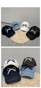 Detailed tile display of cotton baseball caps with 3D embroidery bows in four colors