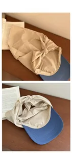Detail of the blue and beige quick-dry cap with a top knot design and canvas brim